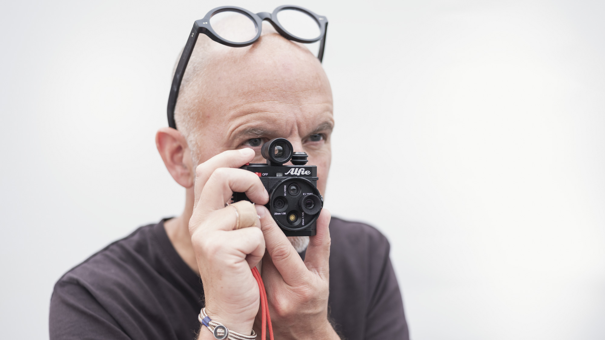 Alfie Tych camera held up to photographer's eye