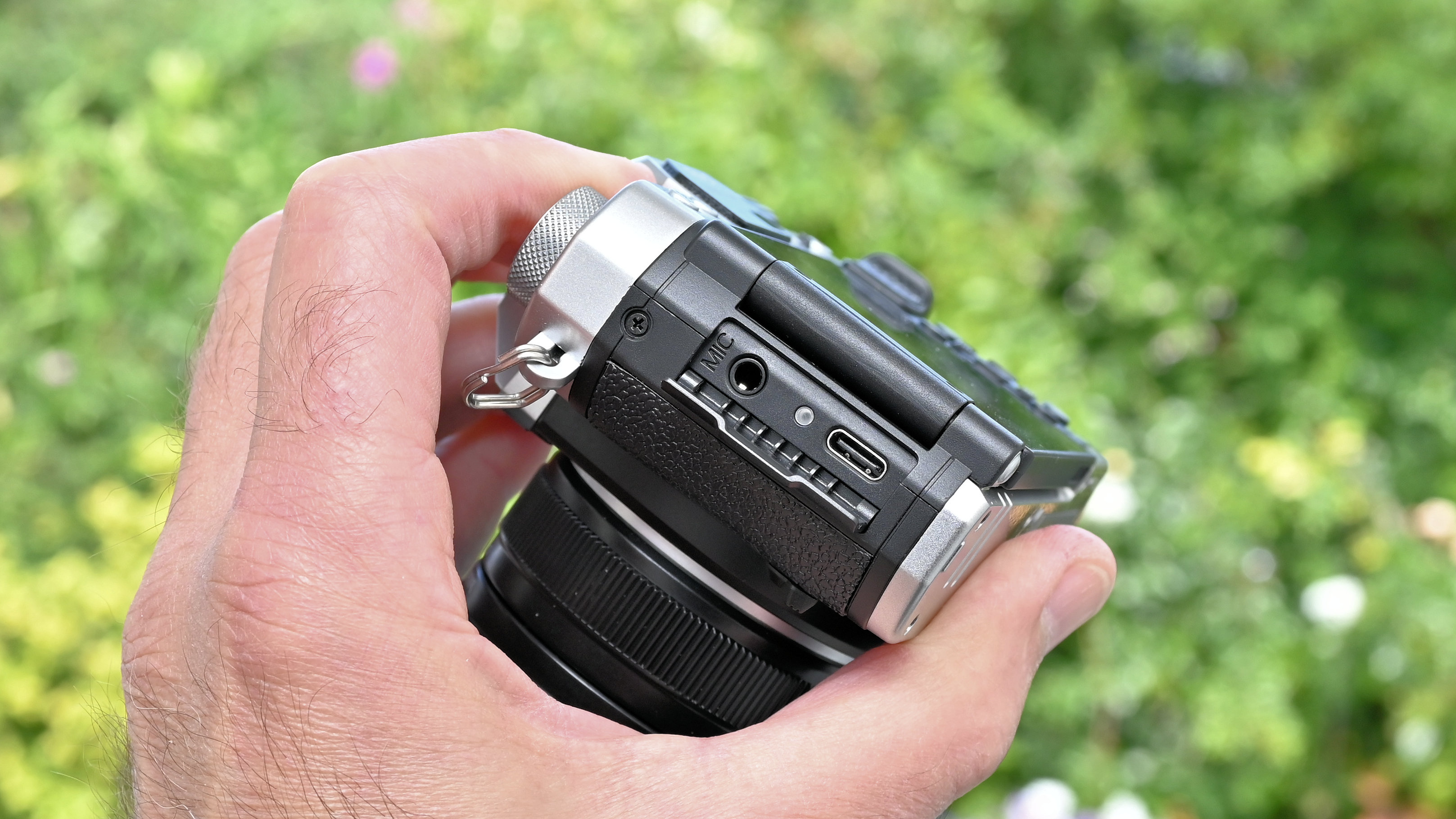 Yashica FX-D 300 product shot, camera held in hand