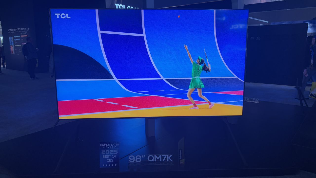 TCL QM7K at the TCL stand with a tennis player and fencers on screen