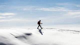 winter hiker wearing snowshoes