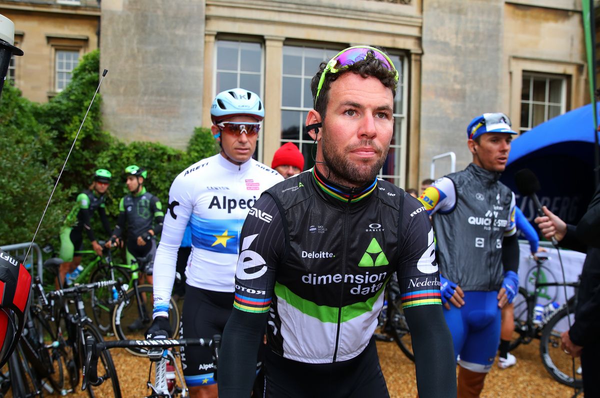 Mark Cavendish waits to sign on