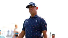 Gary Woodland wearing a navy polo and navy cap during the Houston Open