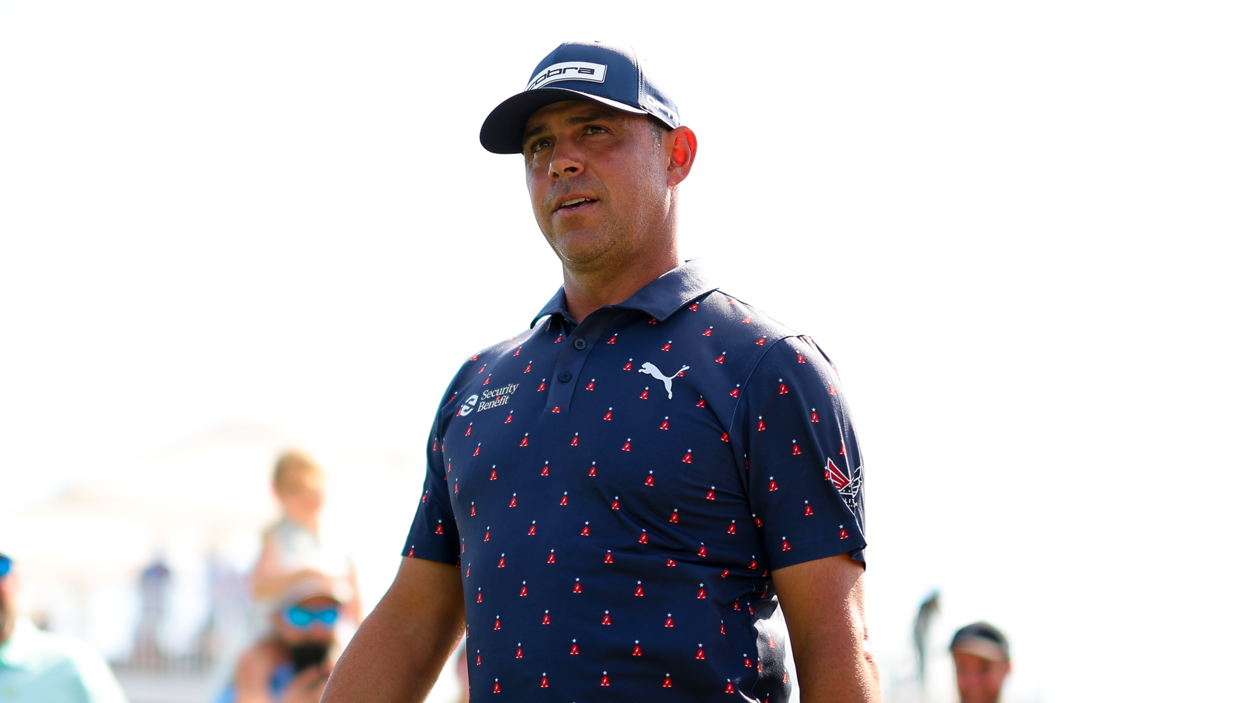 Gary Woodland wearing a navy polo and navy cap during the Houston Open