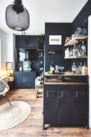 dark navy kitchen with home bar area