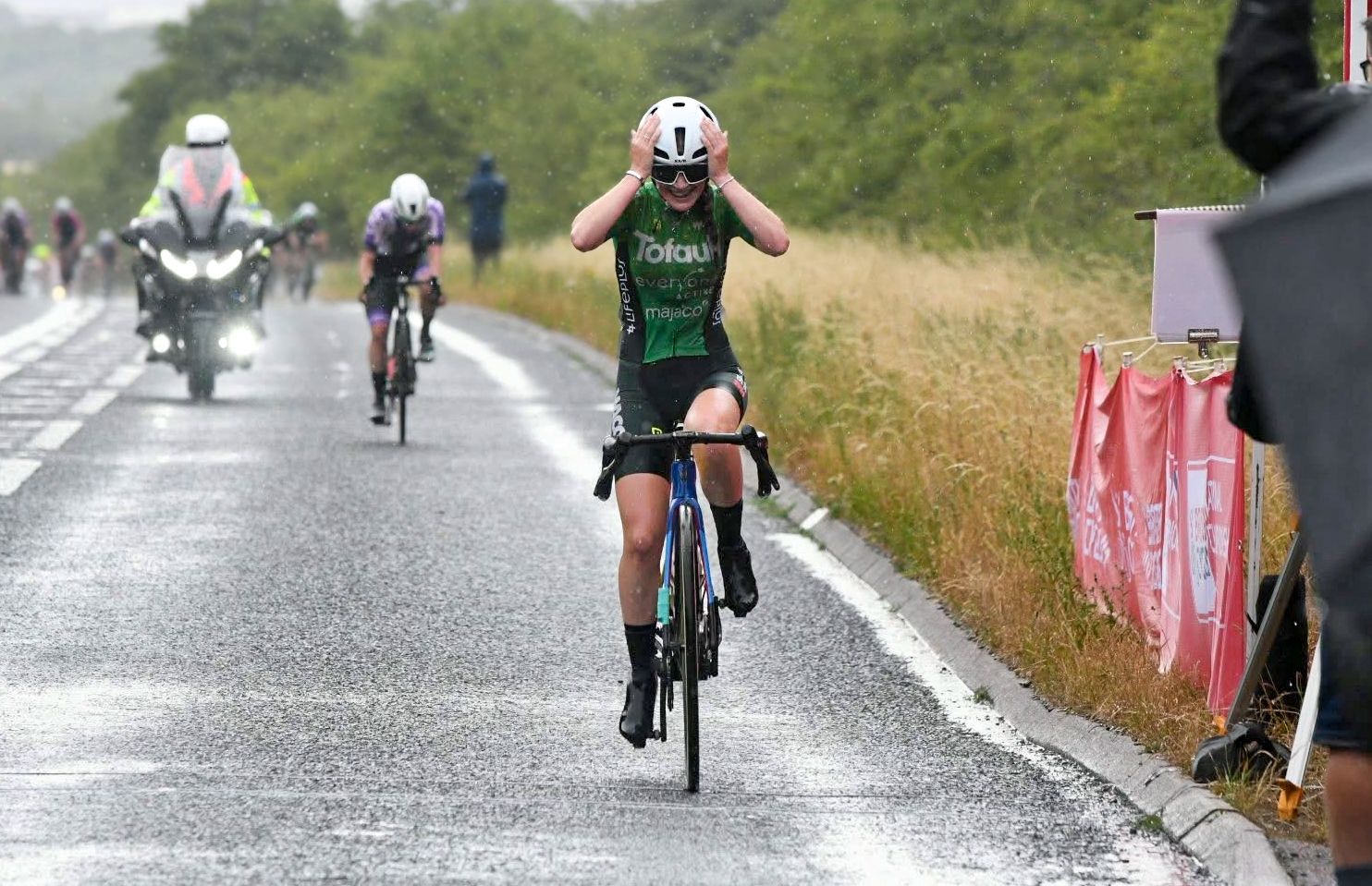 Ruby Isaac wins the junior National Champs in the rain, head in her hands