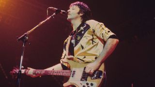 Paul McCartney performs live on stage with Wings at Ahoy on 25th March 1976 in Rotterdam, Netherlands. He plays a Rickenbacker 4001S bass guitar