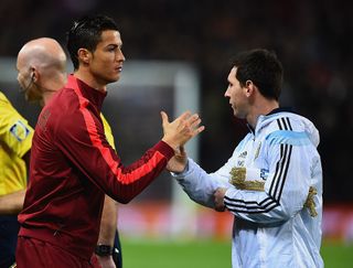 Cristiano Ronaldo of Portugal shakes hands with Lionel Messi of Argentina prior to the International Friendly between Argentina and Portugal at Old Trafford on November 18, 2014 in Manchester, England. (Photo by Laurence Griffiths/Getty Images)