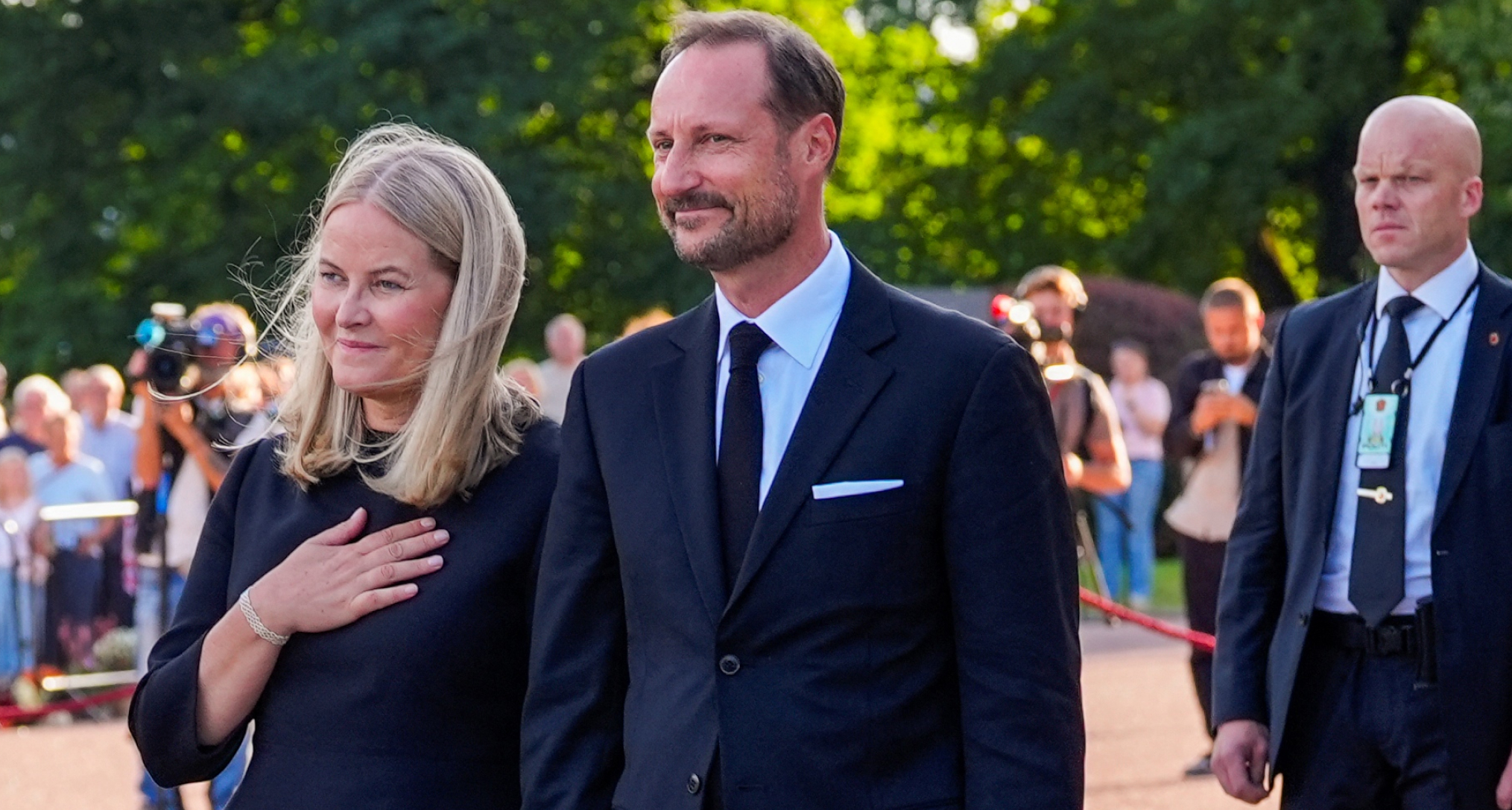 Queen Mette-Marit and King Haaakon wearing black 
