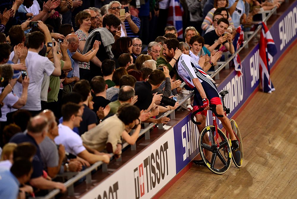 Bradley Wiggins hugs his family after winning the Madison