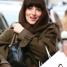 Dakota Johnson sports a stylish wardrobe with a headscarf while shopping in NYC