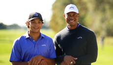 Charlie and Tiger Woods pose for a photo at PNC Championship