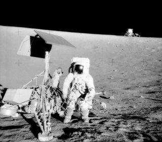 Dust from the landing of Apollo 12, seen in the background in this image, punctured metal on the Surveyor 3, front, from more than 500 feet away.