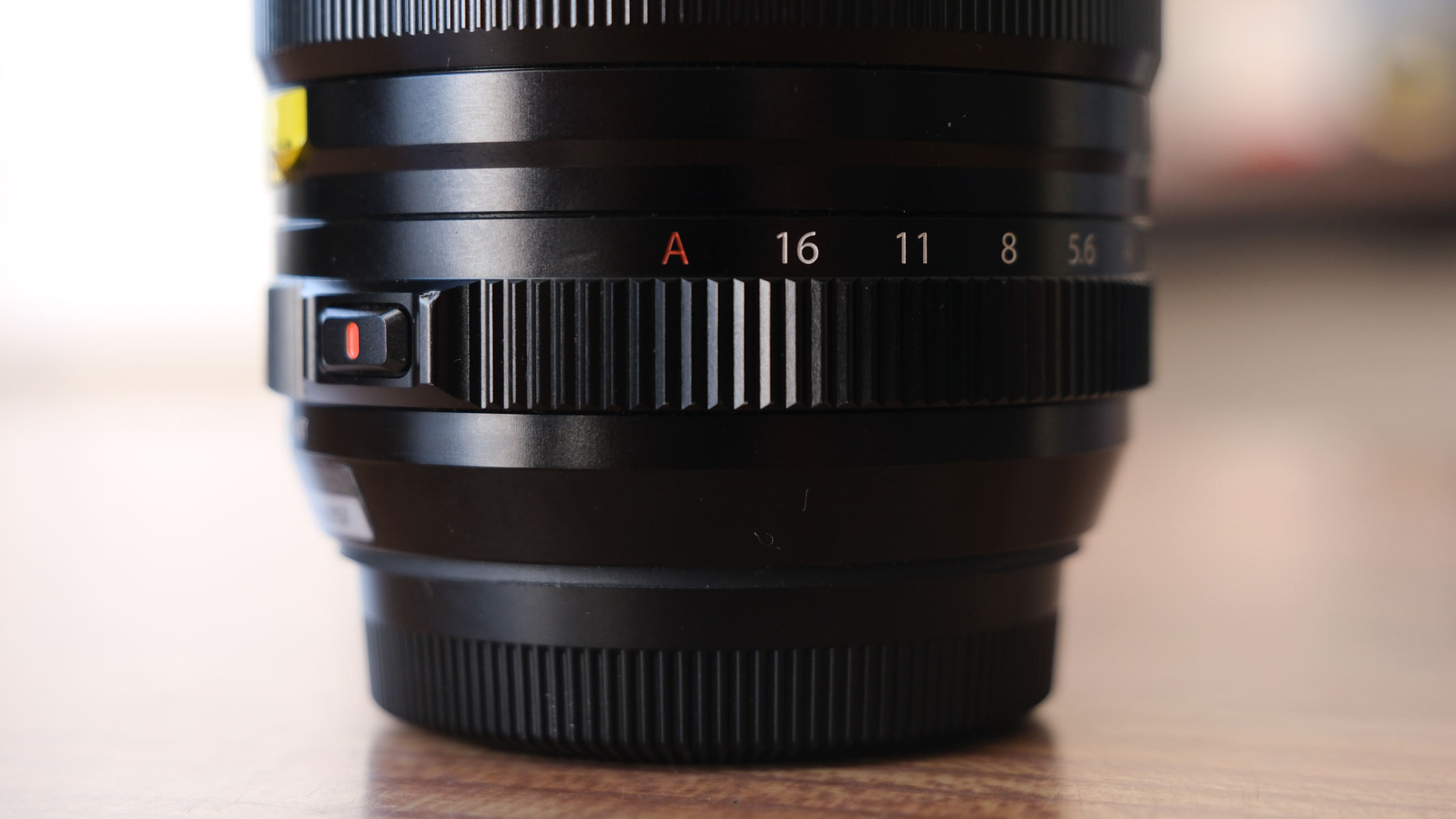 A dial showing the narrowest aperture and auto aperture stops on the Fujifilm XF 18mm f/1.4 lens