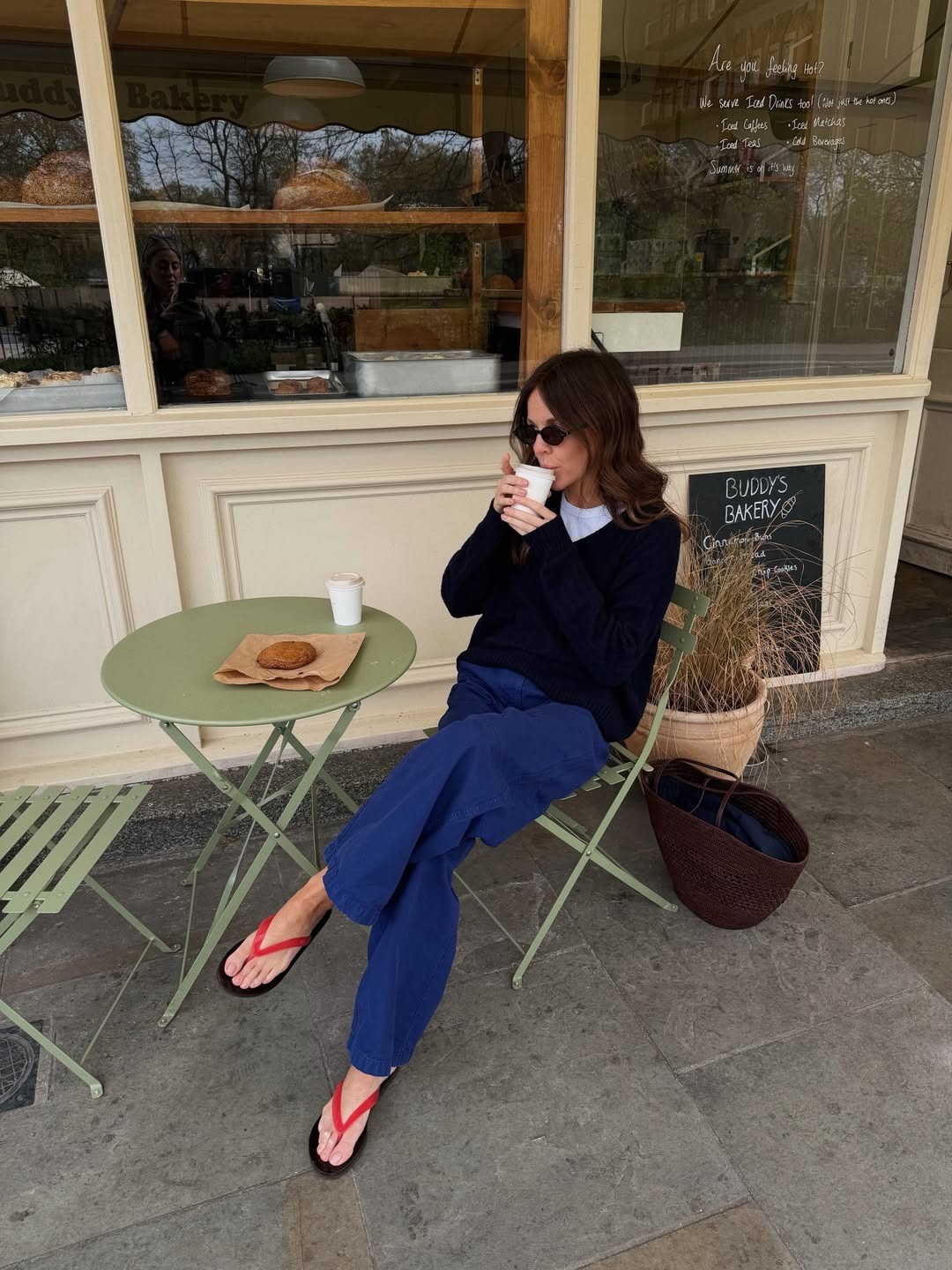 woman in blue pants and a sweater