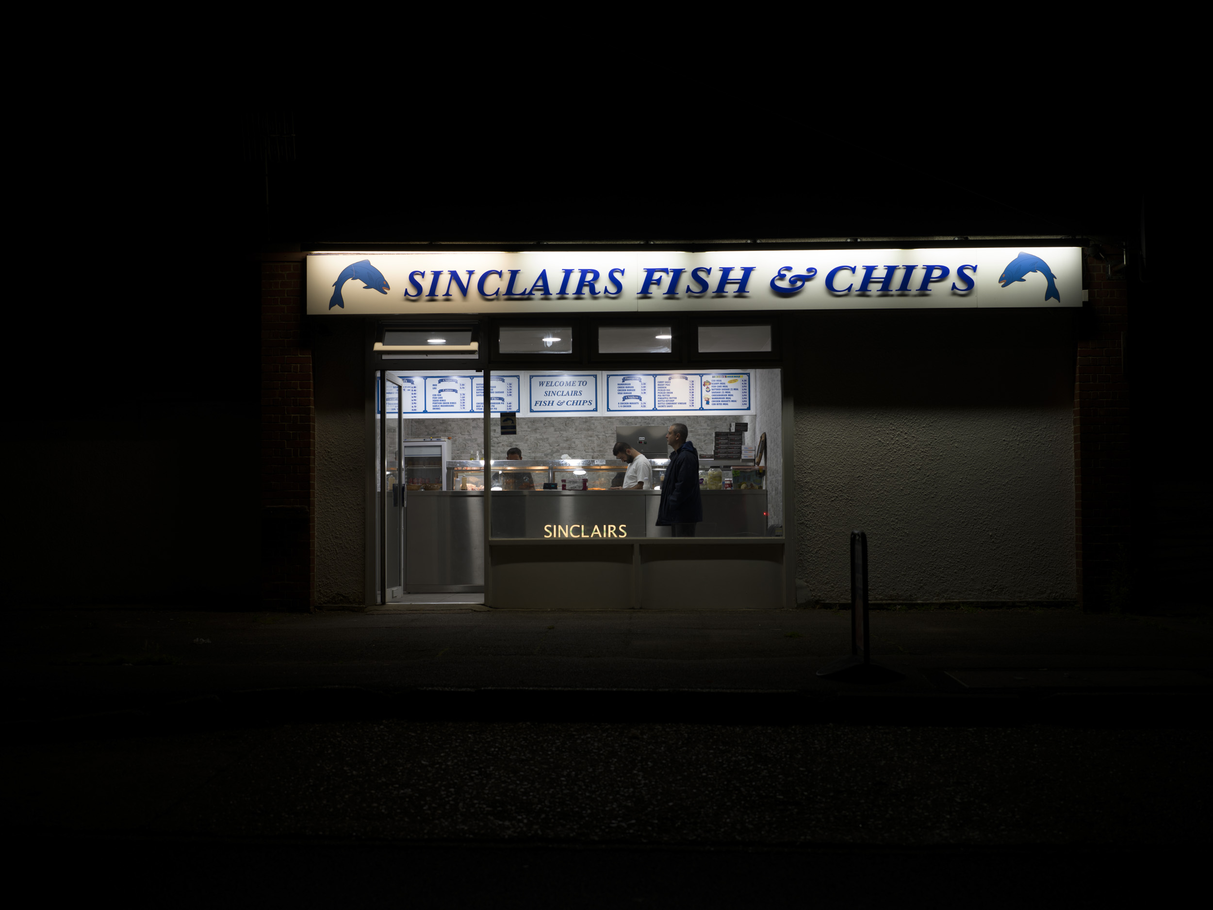 Sample image taken with the Hasselblad X2D 100C of a fish and chip shop at night