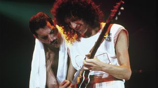 Freddie Mercury & Brian May performing live on stage in 1985