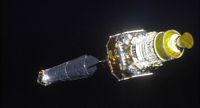 The Chandra X-Ray Observatory and its upper stage are seen in this photo taken by an astronaut on the space shuttle Columbia just after the space telescope was deployed in orbit on July 23, 1999.