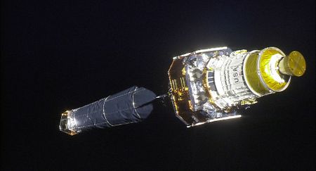 The Chandra X-Ray Observatory and its upper stage are seen in this photo taken by an astronaut on the space shuttle Columbia just after the space telescope was deployed in orbit on July 23, 1999.