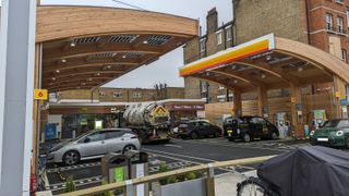 shell recharge fulham forecourt with cars and a tanker truck