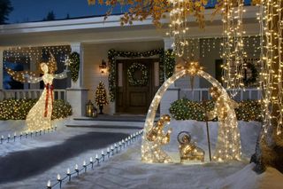 christmas decor and lights outside a festively decorated home