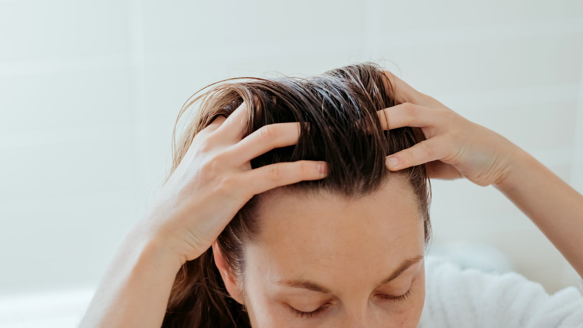 Woman running hands through hair