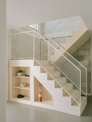 staircase doubling as storage inside cornwall house by of Architecture