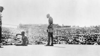 Jack Johnson (R) knocks out Jim Jeffries, who had come out of retirement. The battle, lasting 15 rounds, was staged on July 4, 1910, in Reno, Nevada.