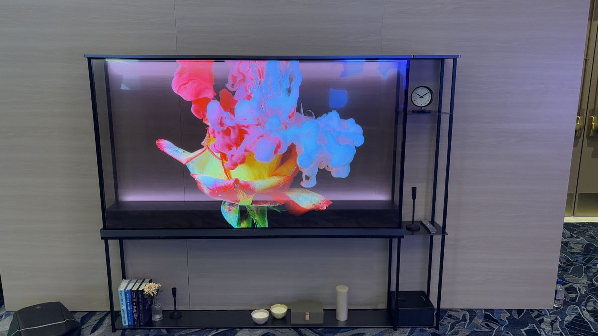 LG OLED T transparent TV against a wooden wall background