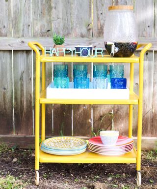 A diy bar cart upcycle using Rust-Oleum yellow metal paint and primer