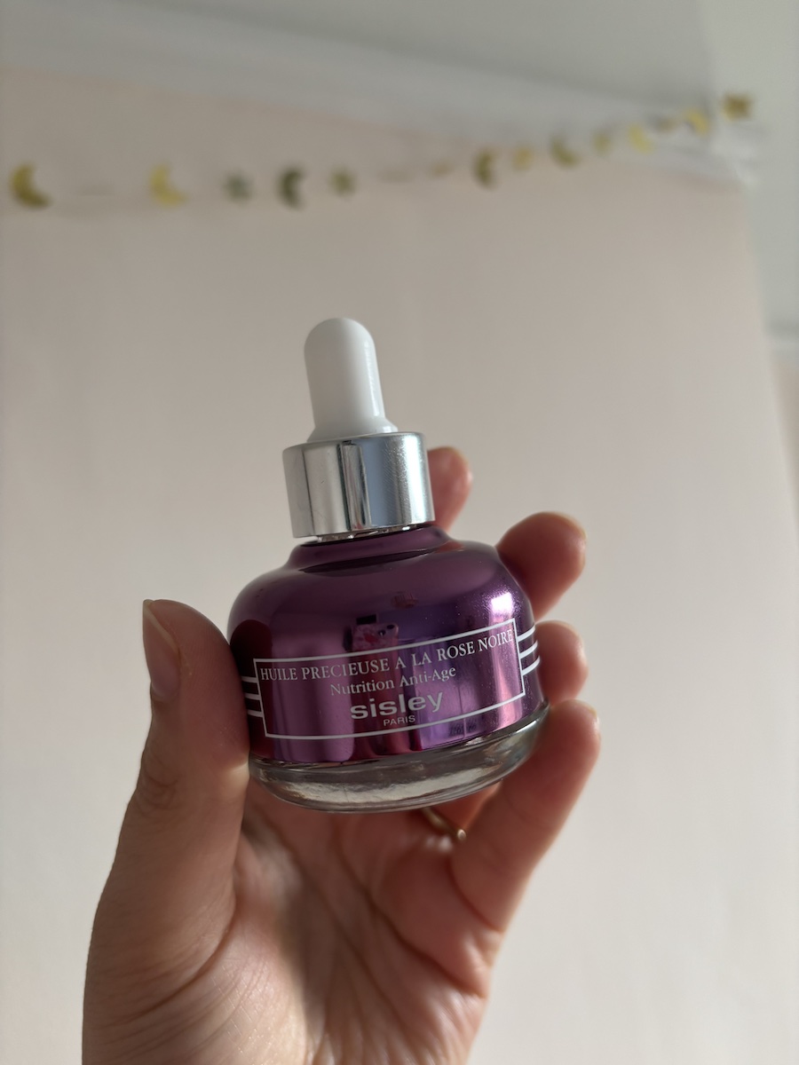 Mica Ricketts holding Sisley Black Rose oil