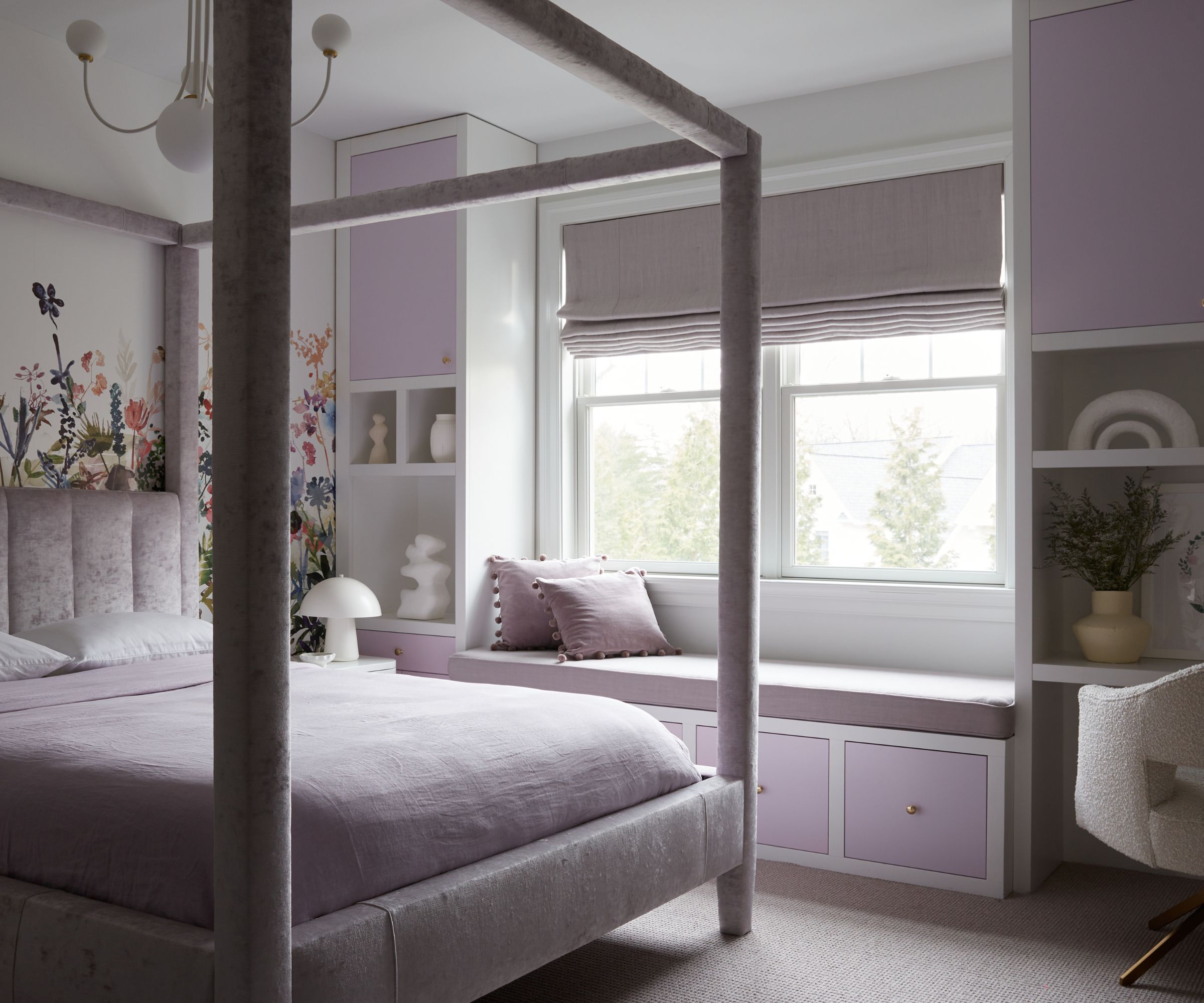 lilac bedroom with floral mural and four poster bed