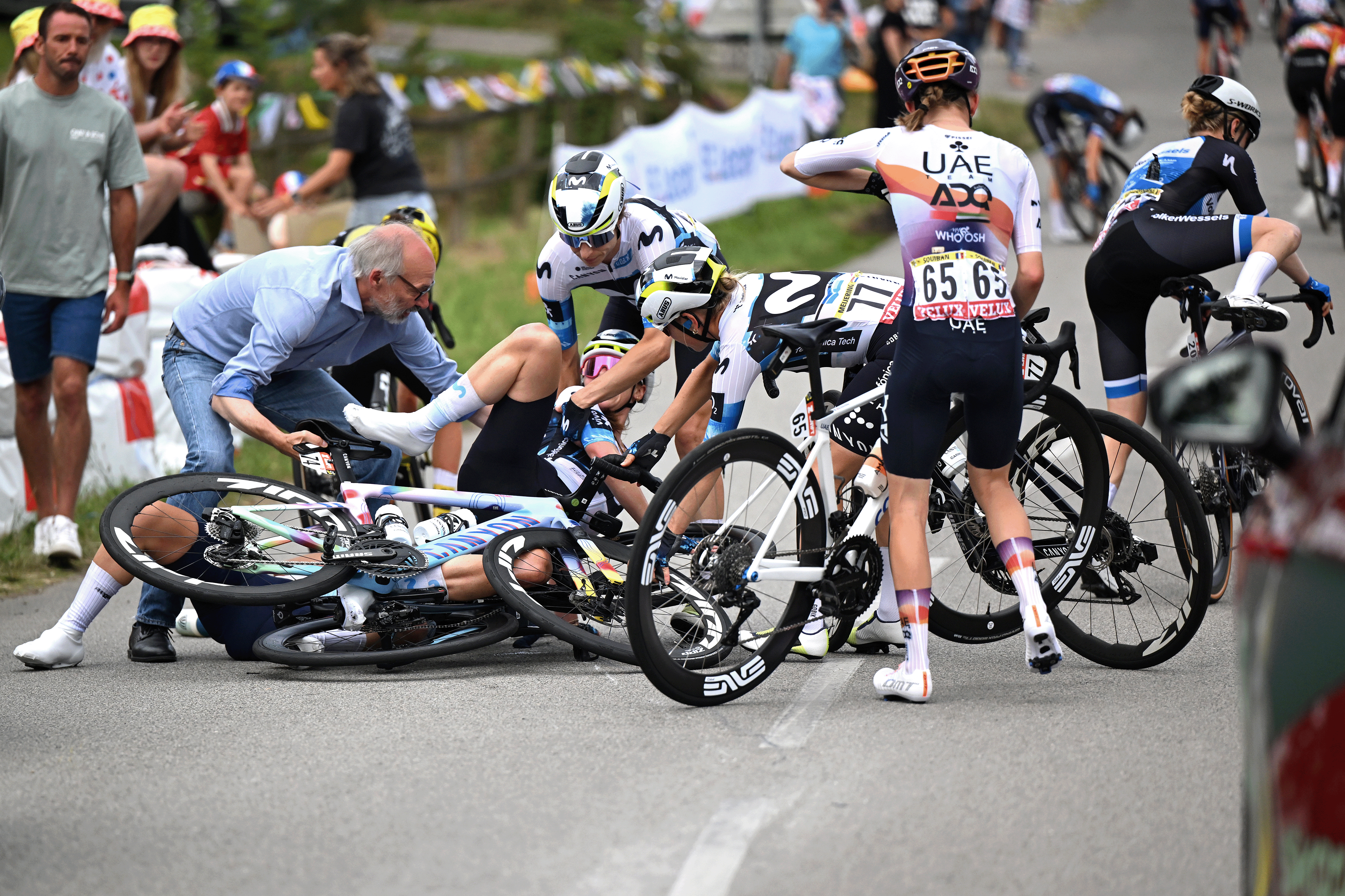 PLUMELEC, FRANCE - JULY 26: (L-R) Liane Lippert of Germany, Marlen Reusser of Switzerland, Mareille Meijering of Netherlands and Team Movistar and Maeva Squiban of France and UAE Team ADQ after being involved in a crash during the 4th Tour de France Femmes 2025, Stage 1 a 78.8km stage from Vannes to Plumelec / #UCIWWT / on July 26, 2025 in Plumelec, France. (Photo by Szymon Gruchalski/Getty Images)