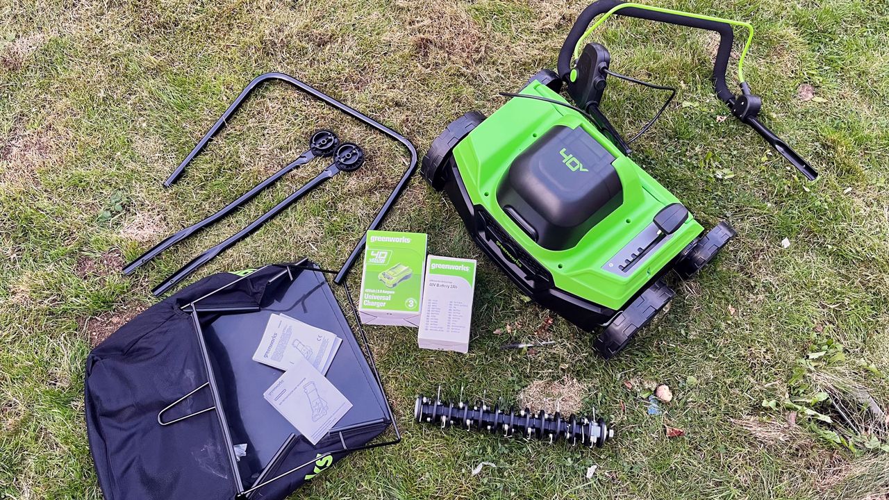 Greenworks 40V 14in Cordless Dethatcher / Scarifier components laid out side by side