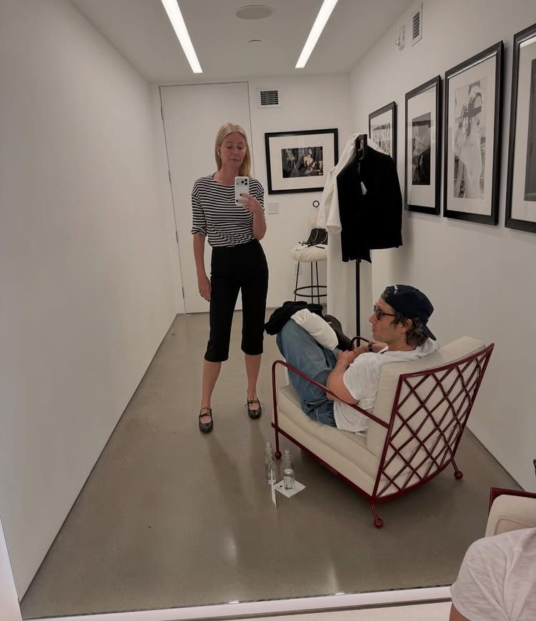 An image of @gwynethpaltrow wearing lace-up ballet flats, capri leggings and striped long-sleeved shirt.