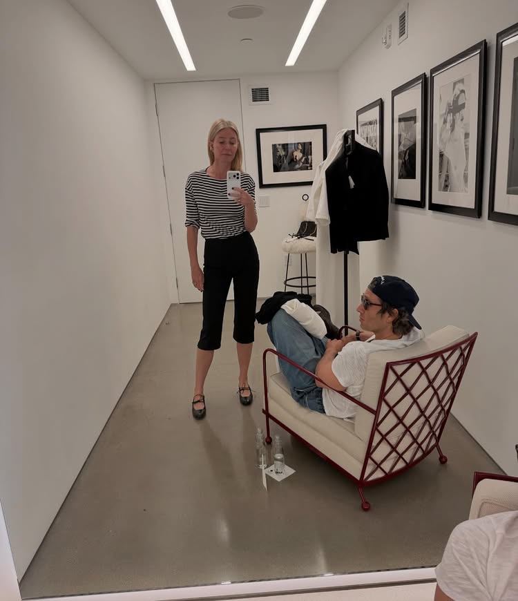 An image of @gwynethpaltrow wearing lace-up ballet flats, capri leggings and striped long-sleeved shirt.