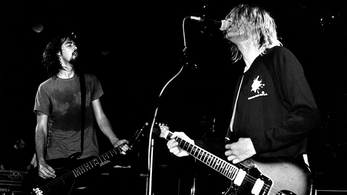 Krist Novoselic (left) and Kurt Cobain performing live onstage