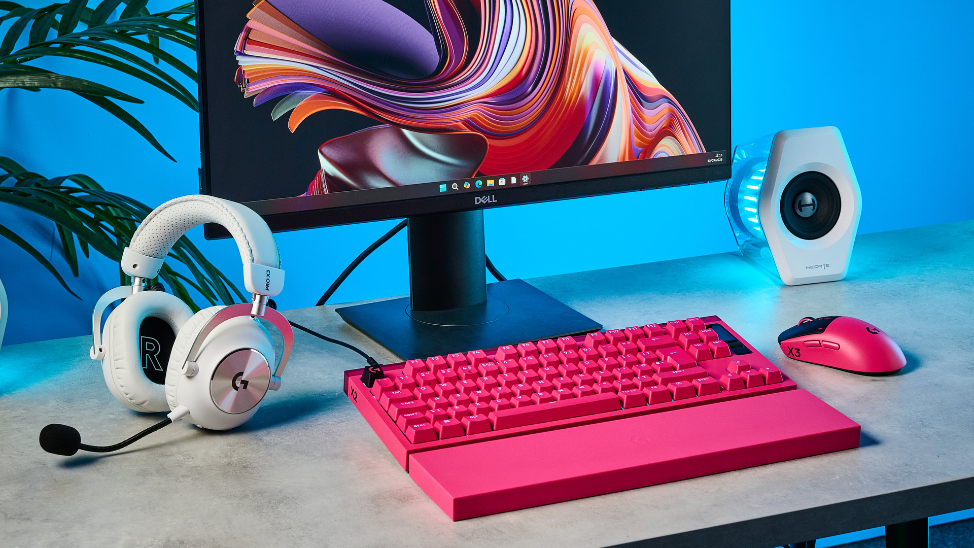 A photo of a desk setup including the Logitech Pro X2 Rapid keyboard, Logitech Pro X3 SuperStrike mouse and Pro X3 Lightspeed headset.