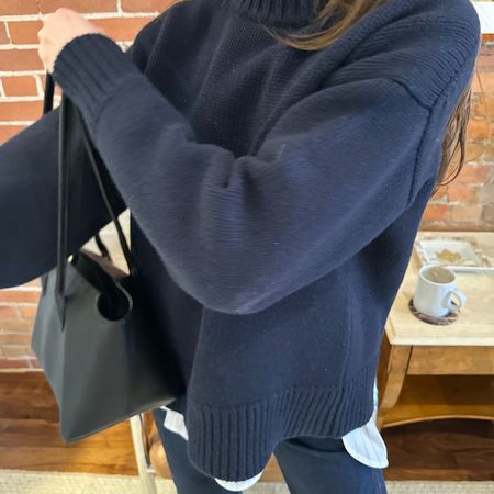 Anna Porte wearing a cashmere sweater. 