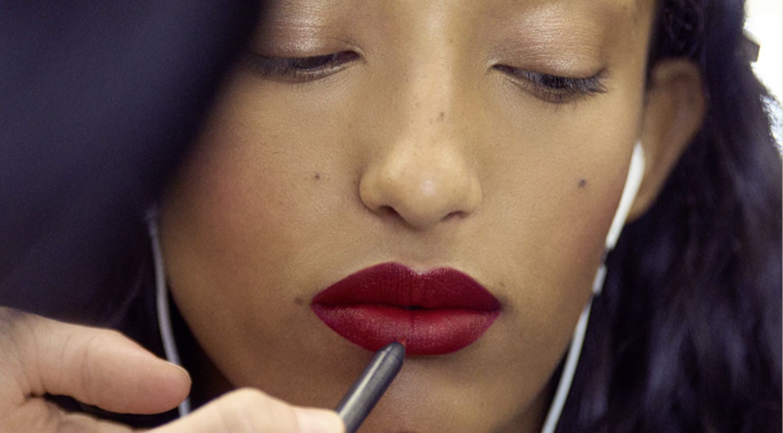 model having red lipstick applied