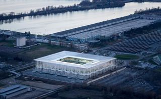 An aerial view of the stadium captured from the sky at dusk