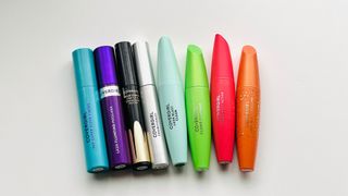 Eight of the best CoverGirl mascara side-by-side on a white table.