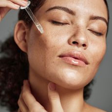 best collagen-boosting serums - Woman applying face serum GettyImages-1473206804