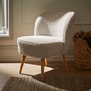 sherpa armchair next to log basket