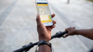 Cyclist navigating by phone map