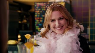 Mel at her bachelorette party wearing a pink feather boa in Virgin River season 6