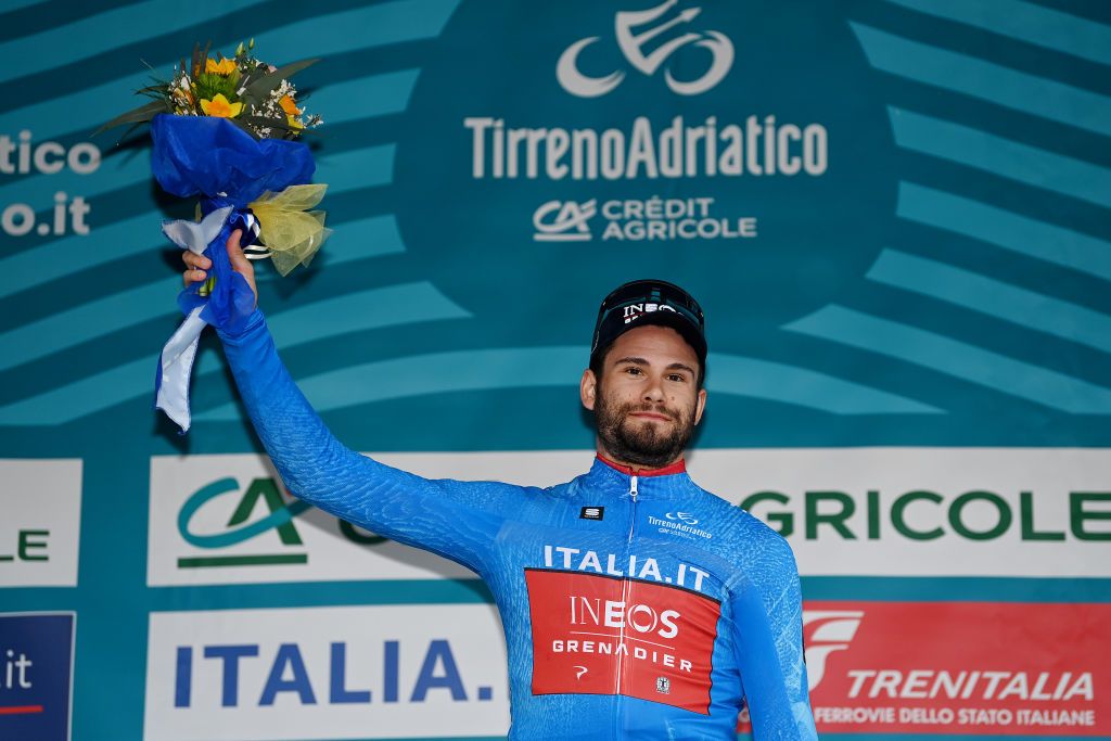 LIDO DI CAMAIORE ITALY MARCH 06 Filippo Ganna of Italy and Team INEOS Grenadiers celebrates at podium as Blue Leader Jersey during the 58th TirrenoAdriatico 2023 Stage 1 a 115km individual time trial from Lido di Camaiore to Lido di Camaiore TirrenoAdriatico ITT on March 06 2023 in Lido di Camaiore Italy Photo by Tim de WaeleGetty Images