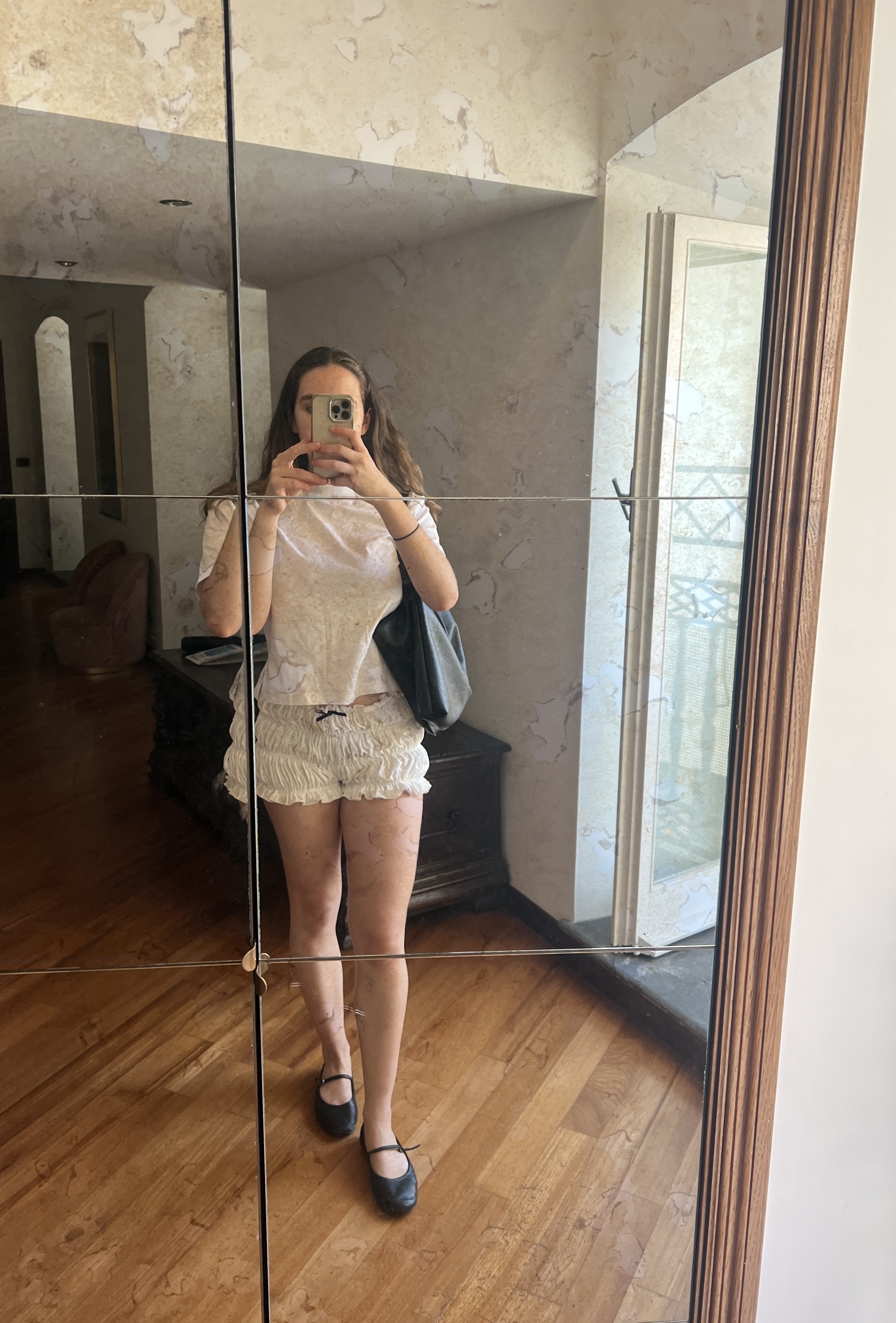 An image ofBest Knockoff Luxury Clothing
 UK SEO Writer Ava Gilchrist wearing a 2025 short trend.