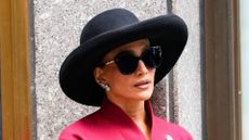 Jennifer Lopez wearing red skirt suit in New York on 10 October, 2025