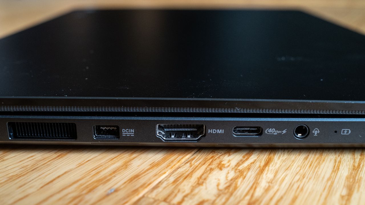Asus ProArt PX13 laptop on a wooden surface
