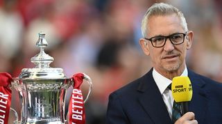 Gary Lineker presents next to the FA Cup Gary Linekr presents alongside the FA Cup for Manchester City's semi-final against Liverpool at Wembley Stadium in April 2022.